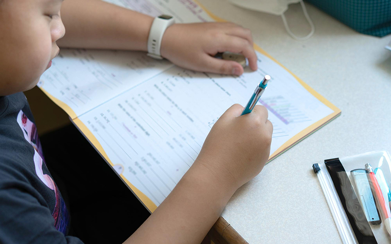 Student practicing hands-on learning in an after-school programme.